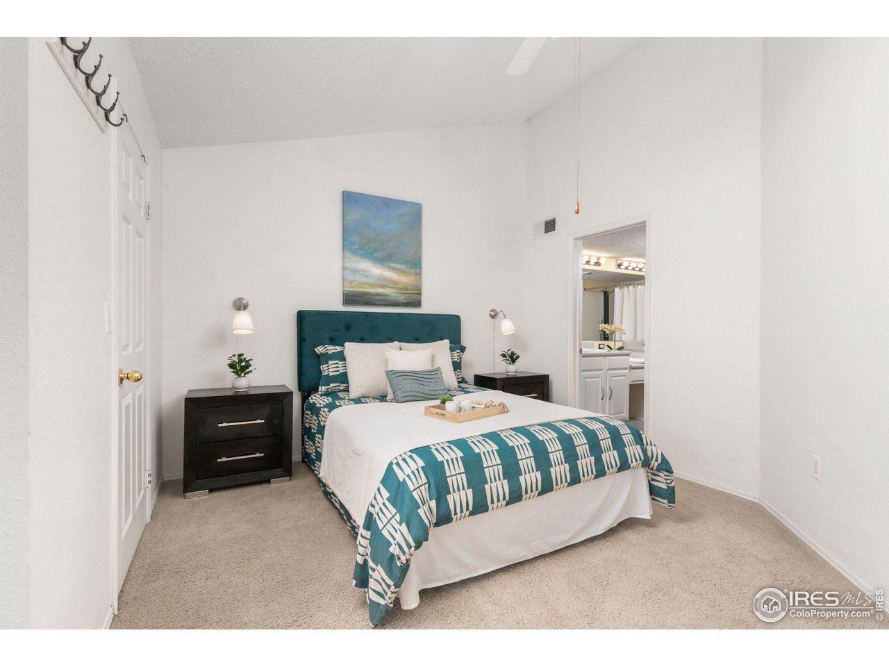 1855 Spaulding Circle Superior, CO 80027 - Photo 8 of 32 a bedroom with a bed and a night stand