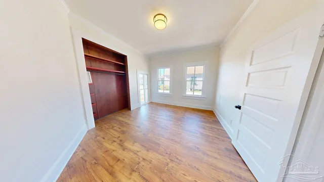 a view of an entryway with wooden floor