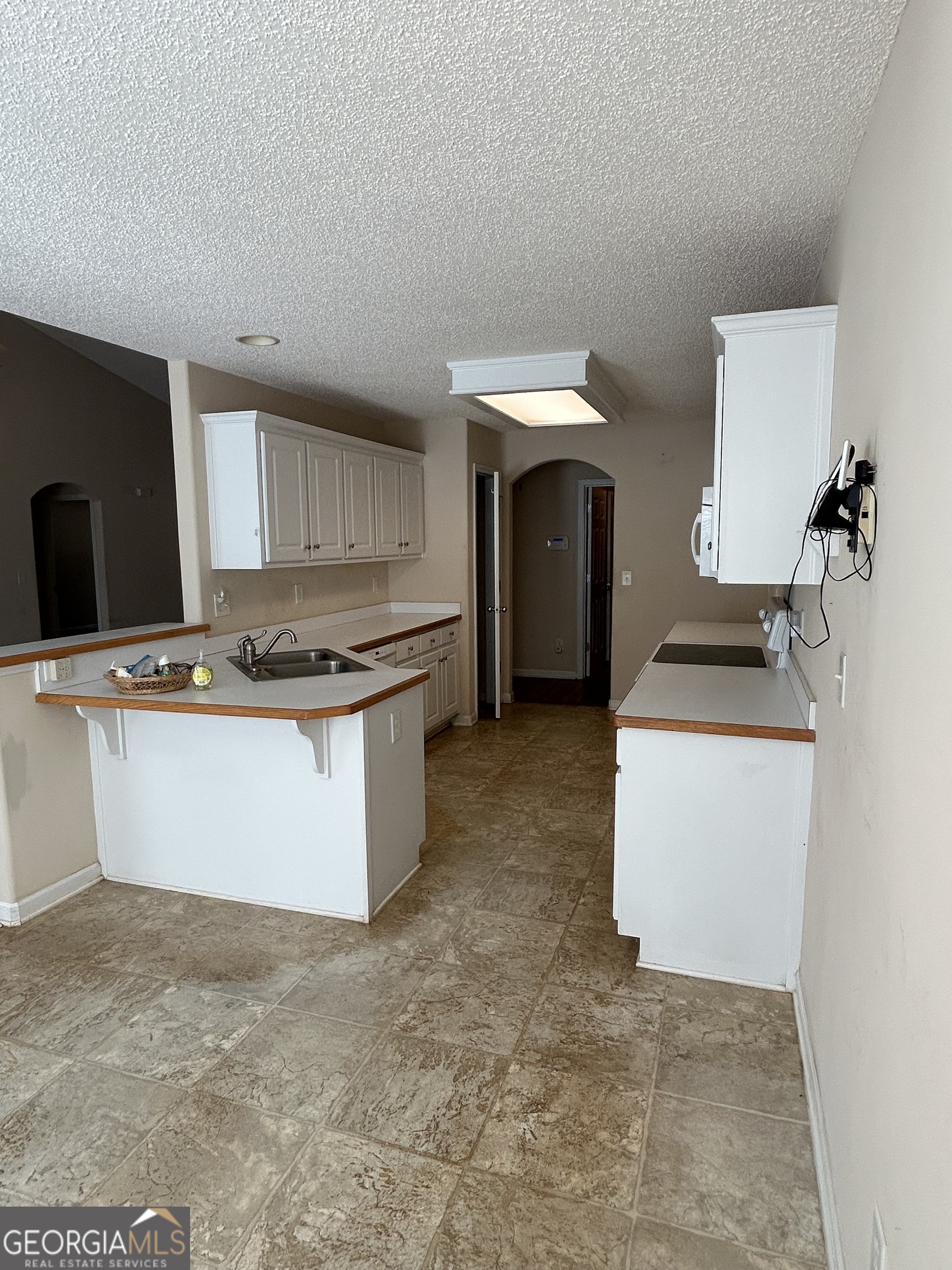 28 Pinewood Circle Colbert, GA 30628 - Photo 14 of 44 a kitchen with a stove and a refrigerator
