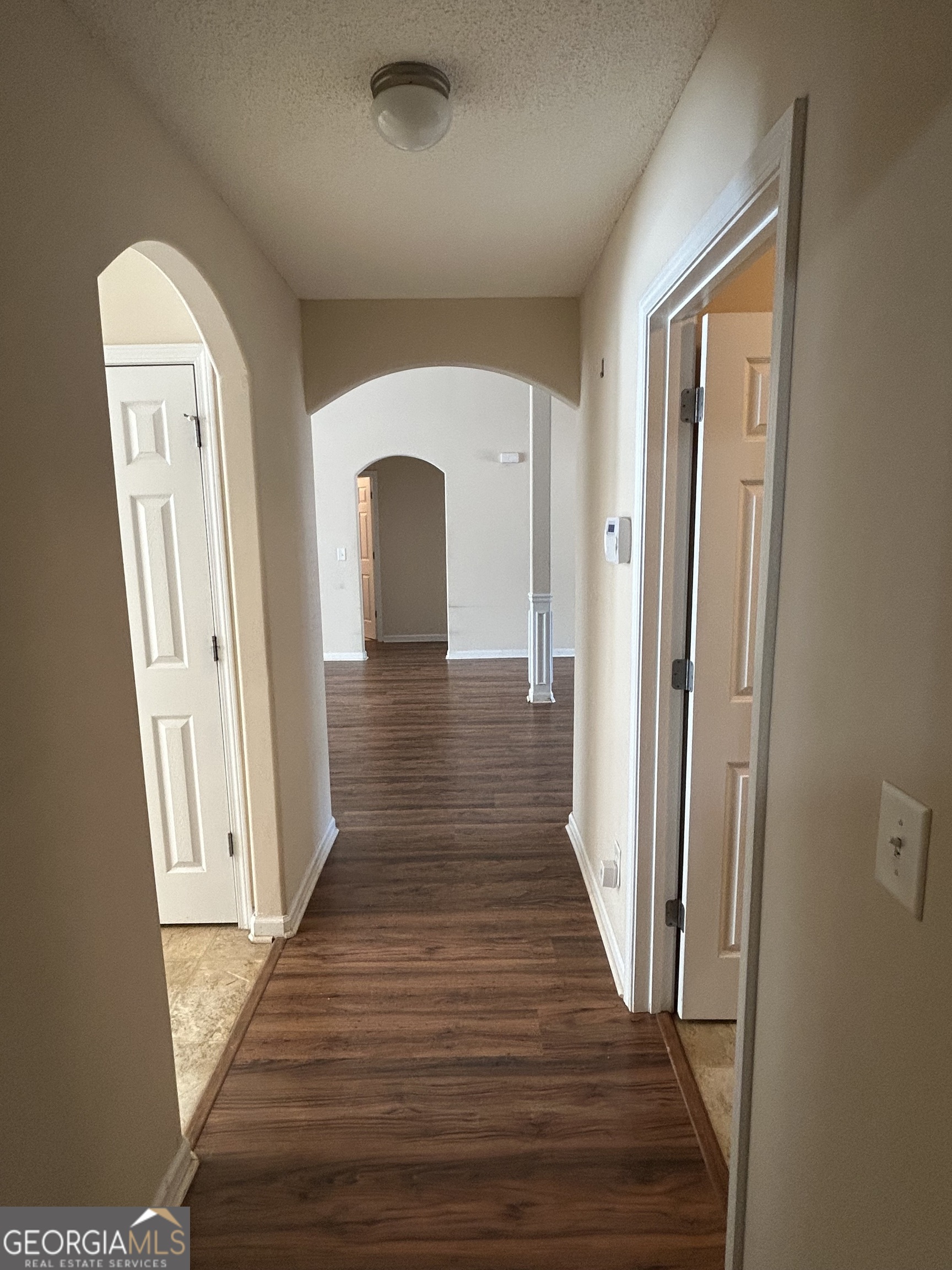 28 Pinewood Circle Colbert, GA 30628 - Photo 18 of 44 a view of a hallway with wooden floor