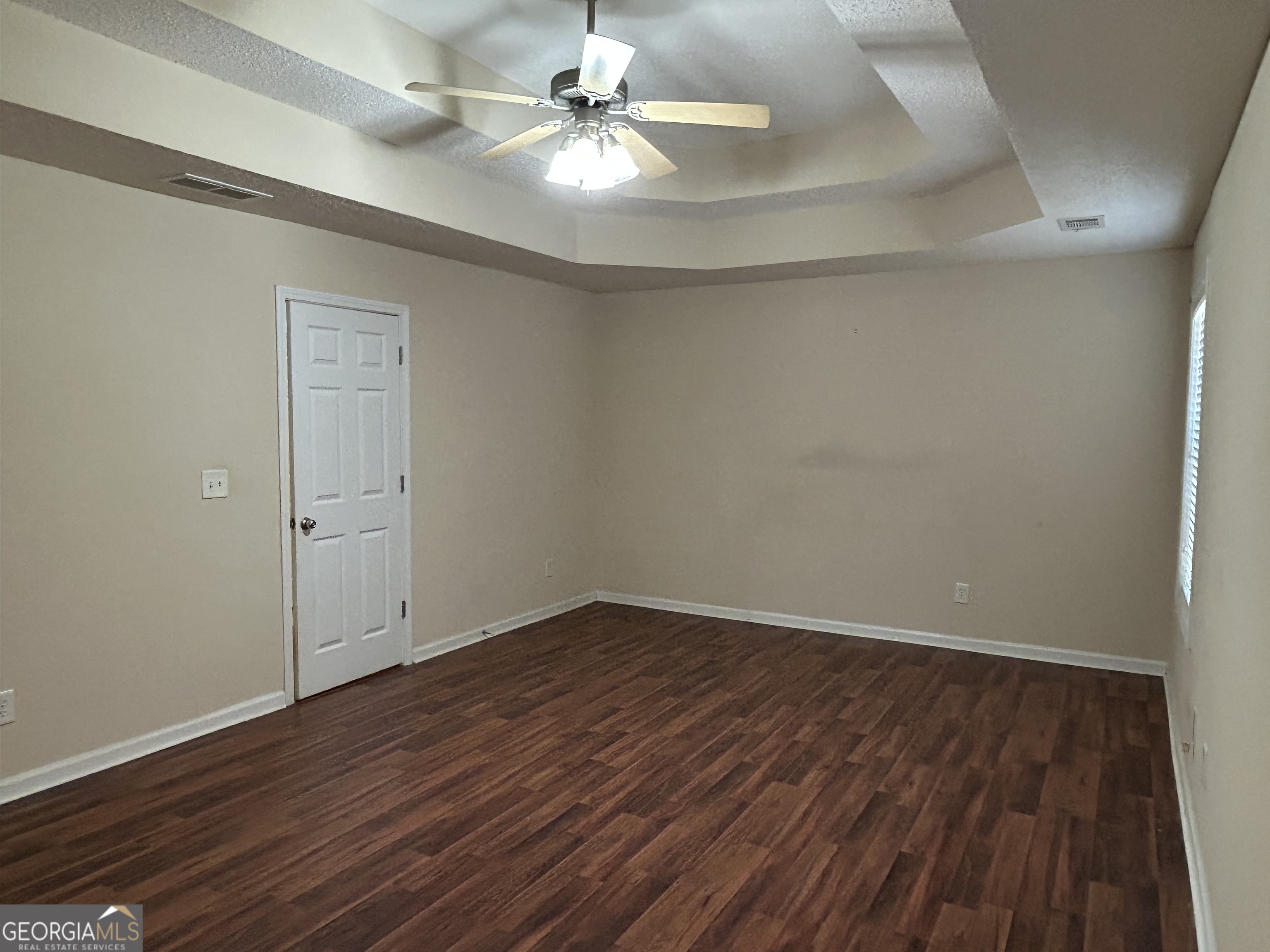 28 Pinewood Circle Colbert, GA 30628 - Photo 20 of 44 wooden floor in an empty room with a window