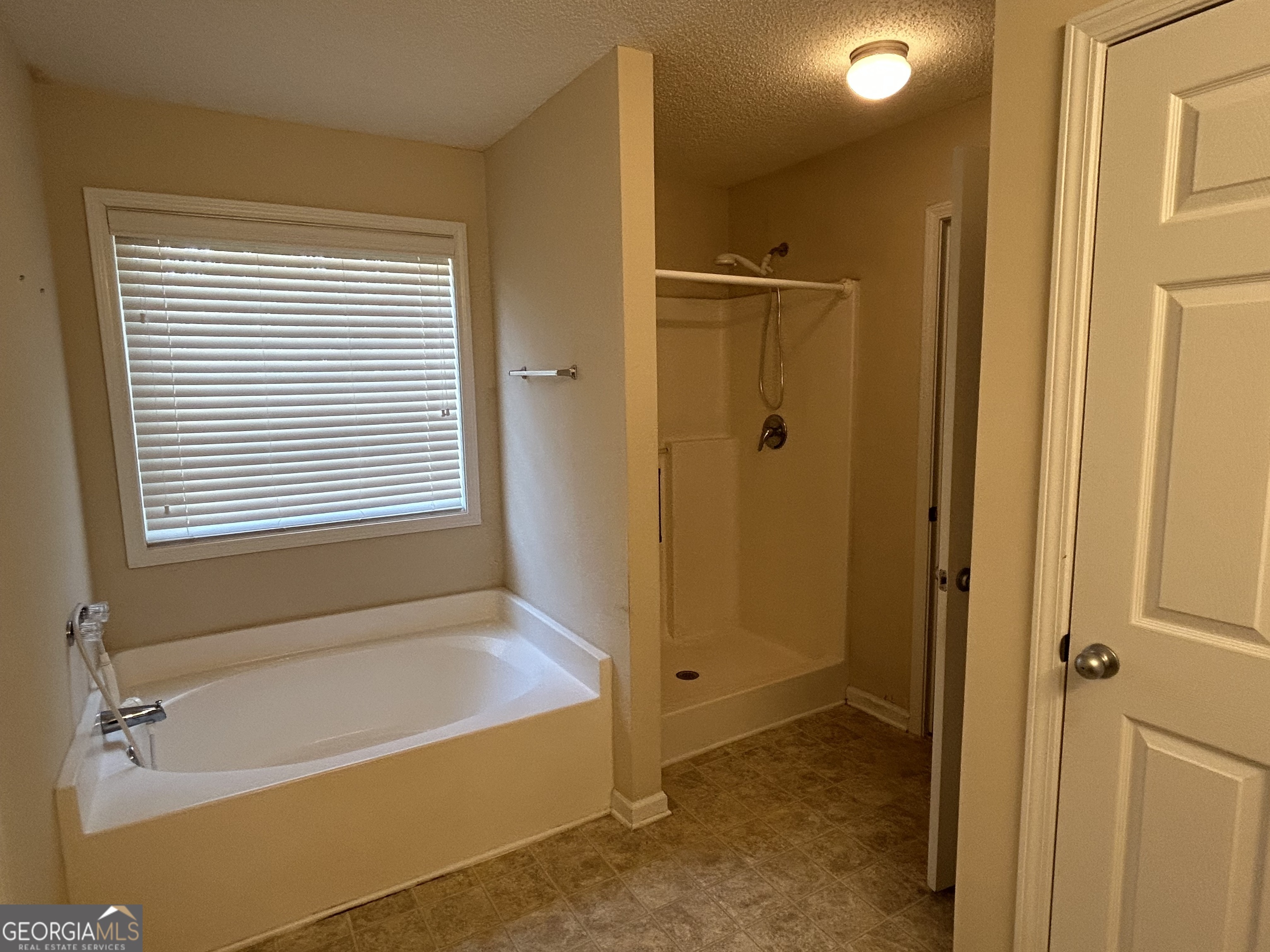 28 Pinewood Circle Colbert, GA 30628 - Photo 22 of 44 a bathroom with a tub shower and a sink