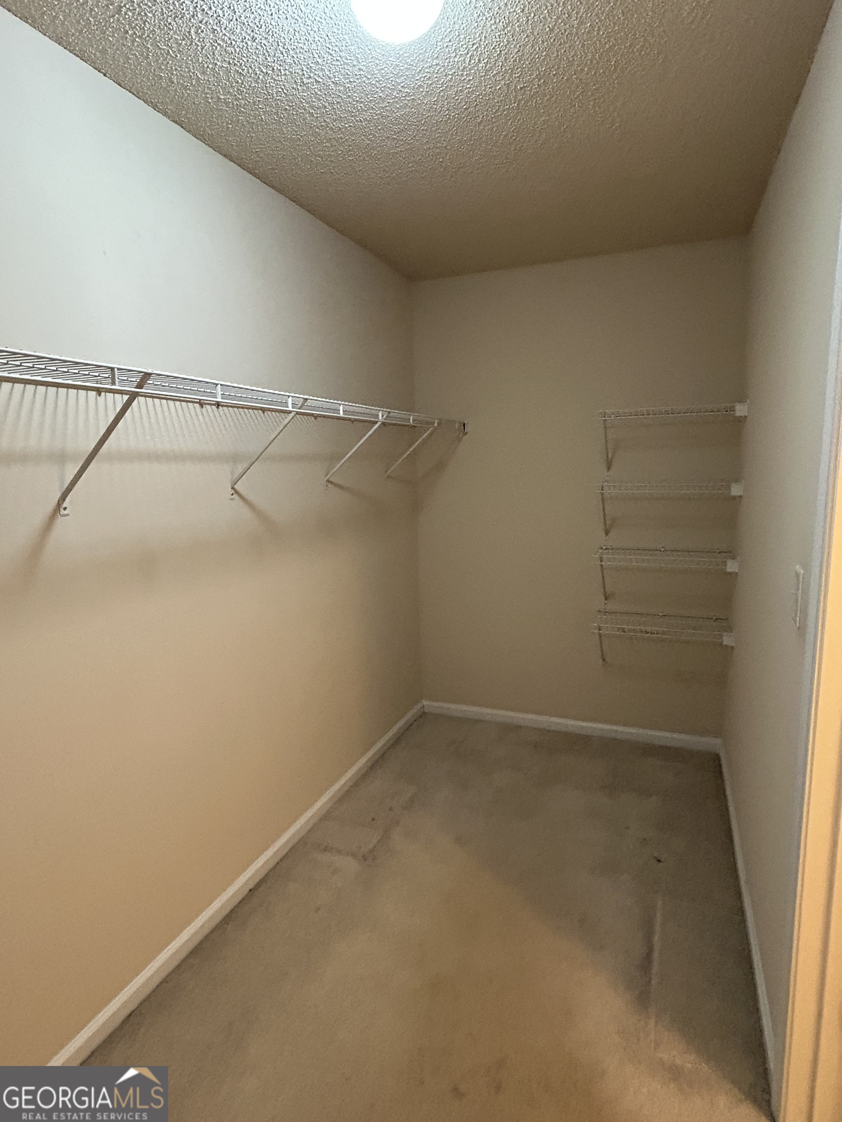 28 Pinewood Circle Colbert, GA 30628 - Photo 25 of 44 a view of a room with racks on the wall