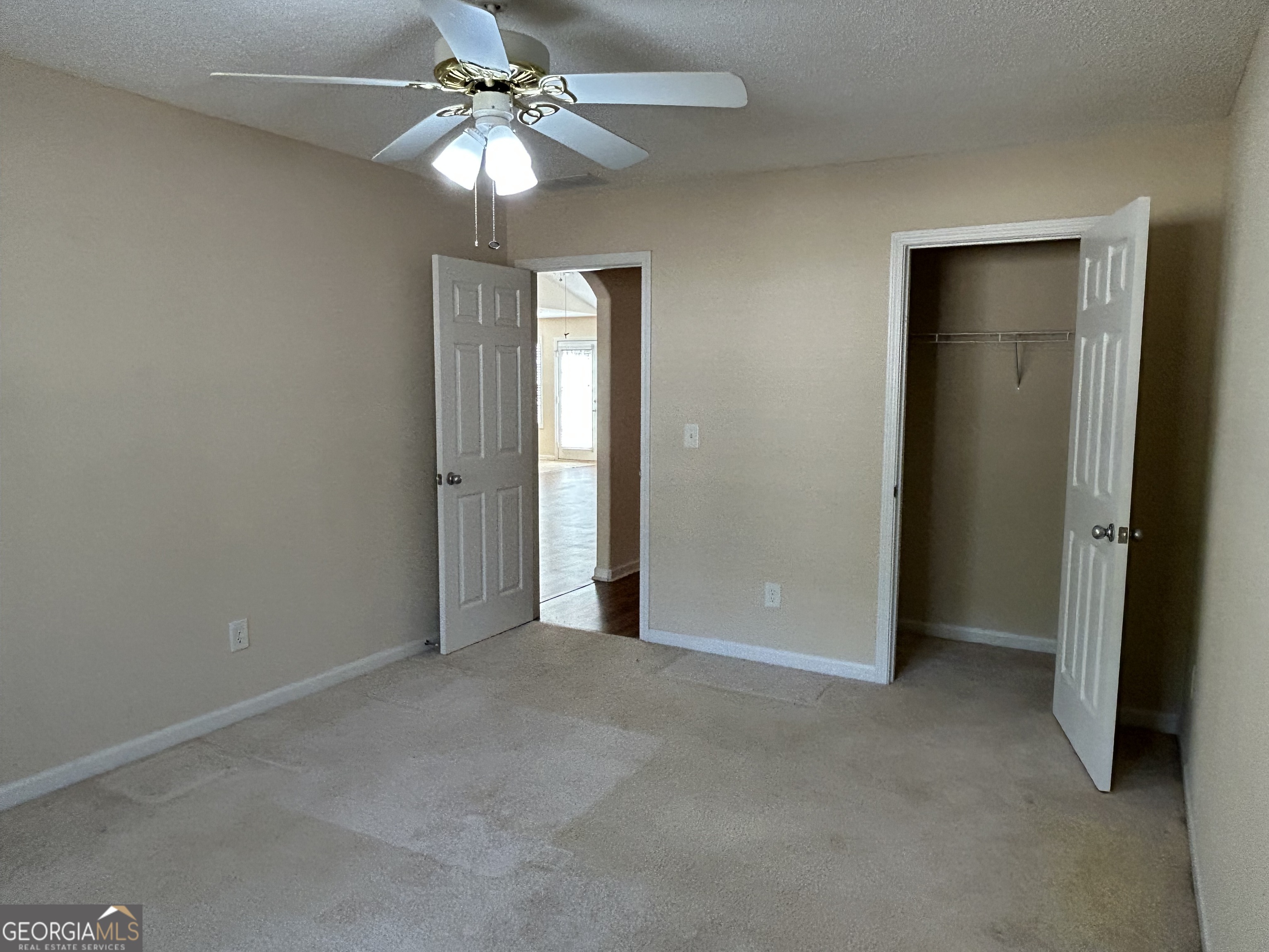 28 Pinewood Circle Colbert, GA 30628 - Photo 27 of 44 an empty room with closet and a chandelier fan