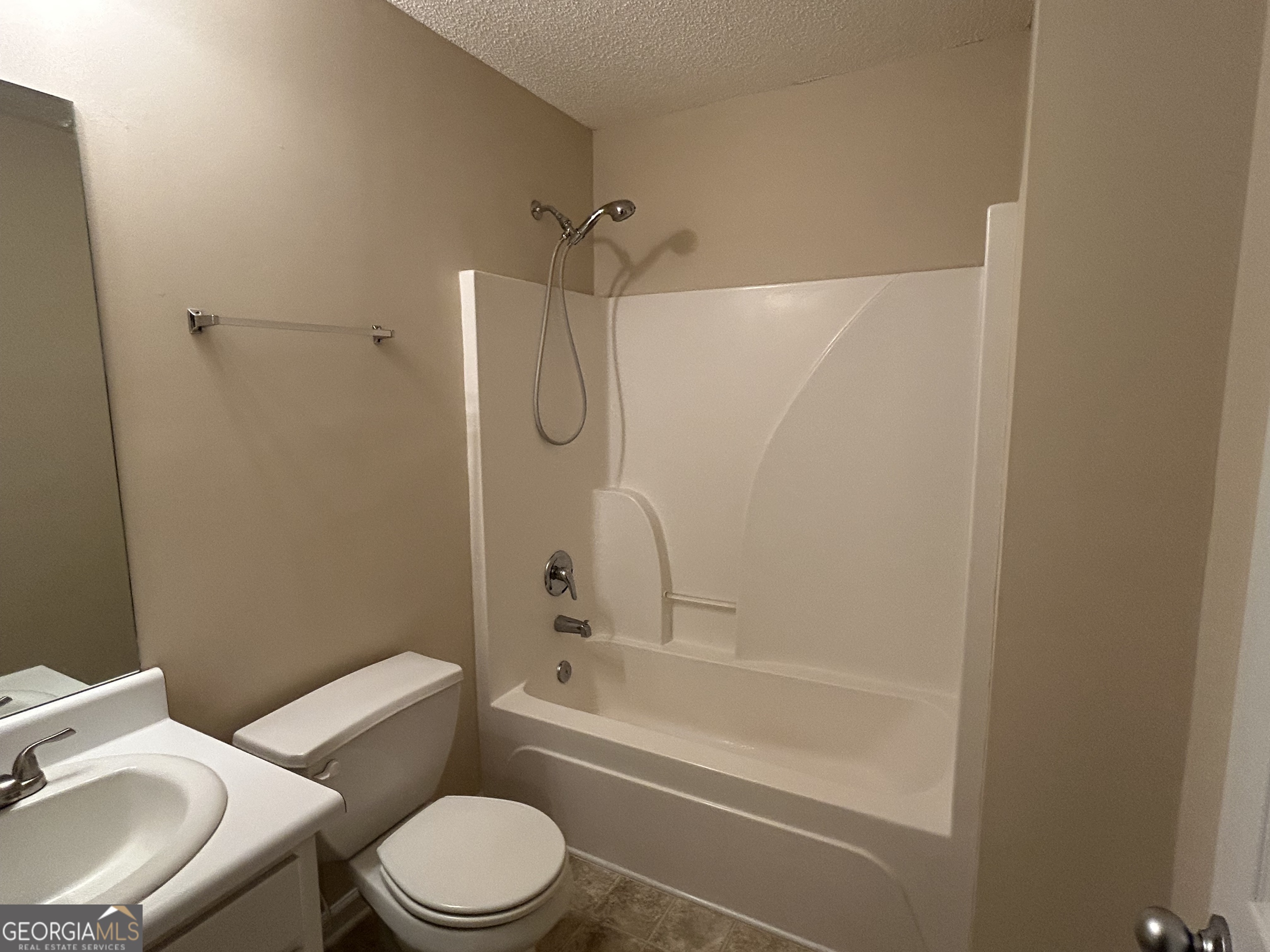 28 Pinewood Circle Colbert, GA 30628 - Photo 30 of 44 a bathroom with a toilet sink vanity and shower