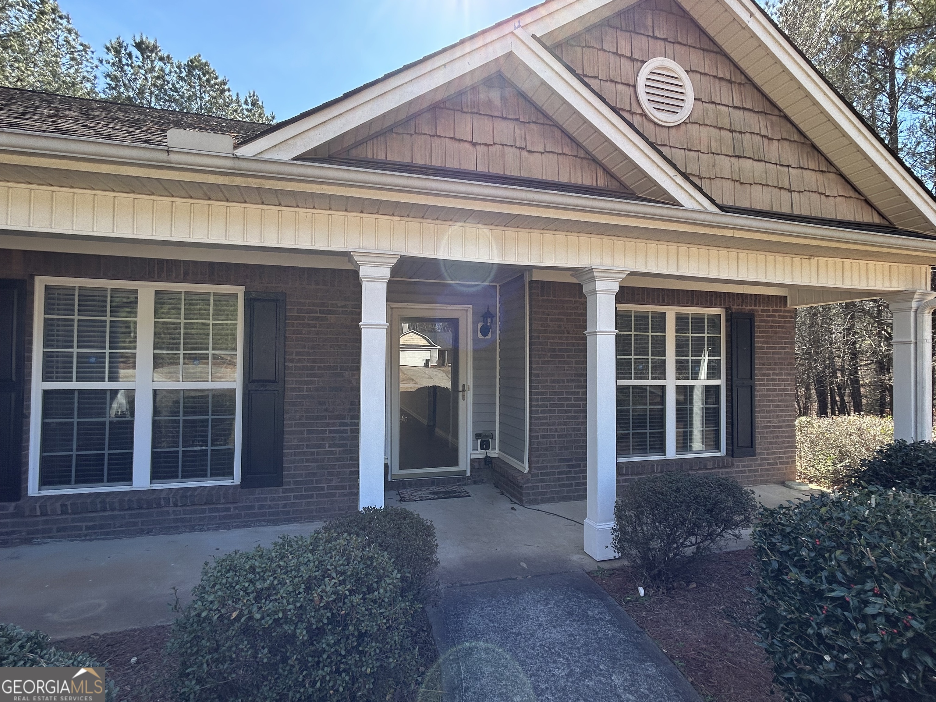 28 Pinewood Circle Colbert, GA 30628 - Photo 4 of 44 front view of a brick house with a large window