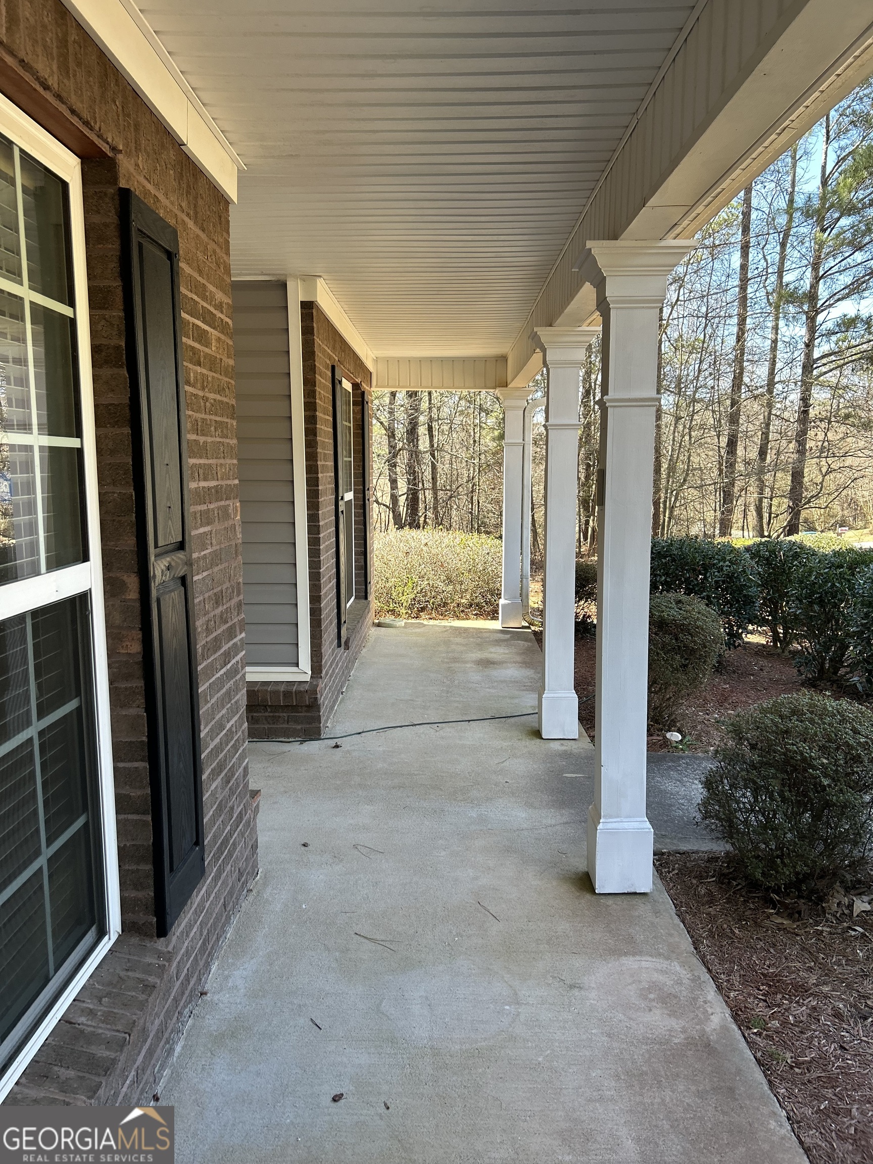 28 Pinewood Circle Colbert, GA 30628 - Photo 5 of 44 a view of a porch with wooden floor and stairs