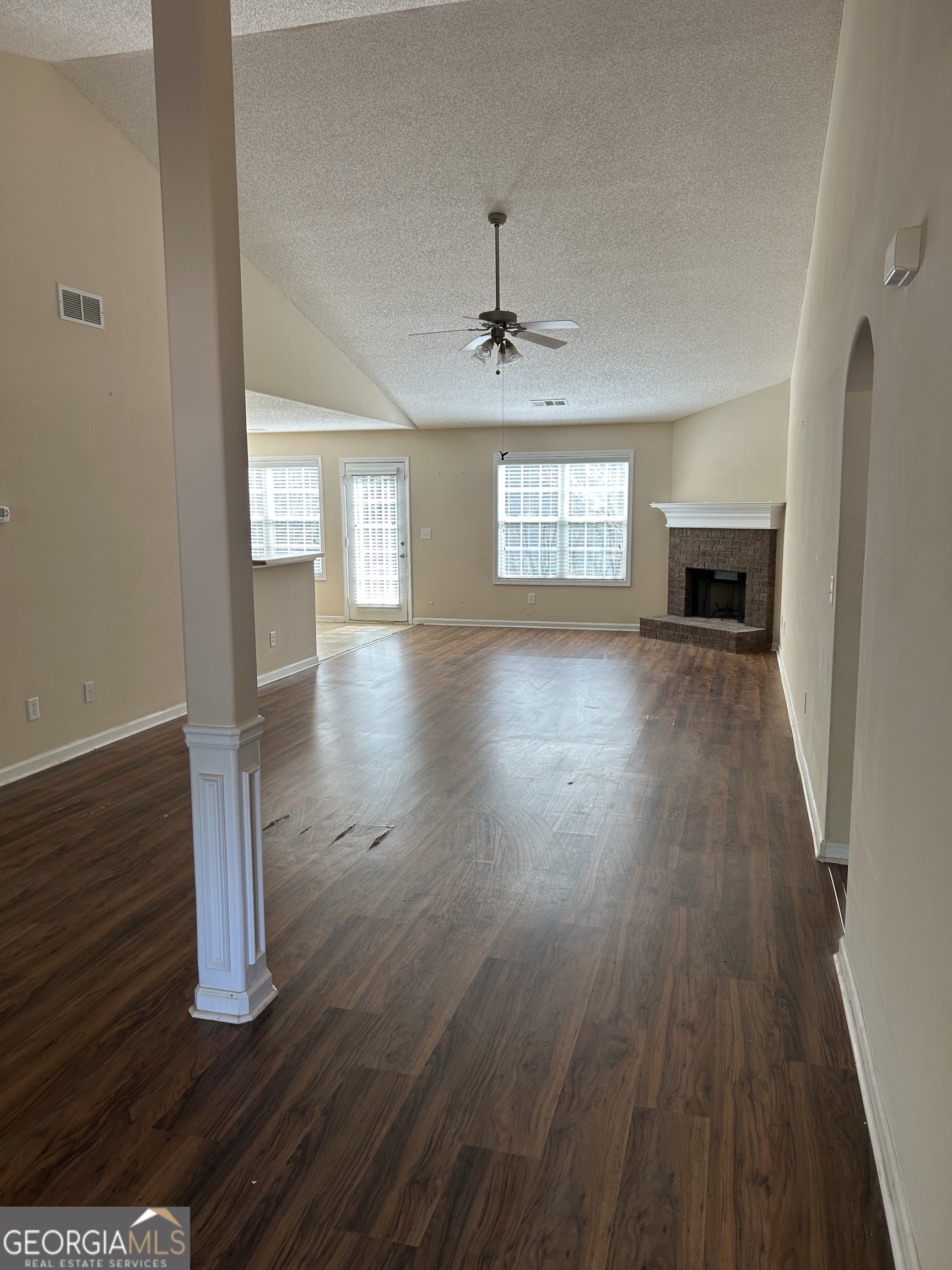 28 Pinewood Circle Colbert, GA 30628 - Photo 6 of 44 wooden floor in an empty room with a window