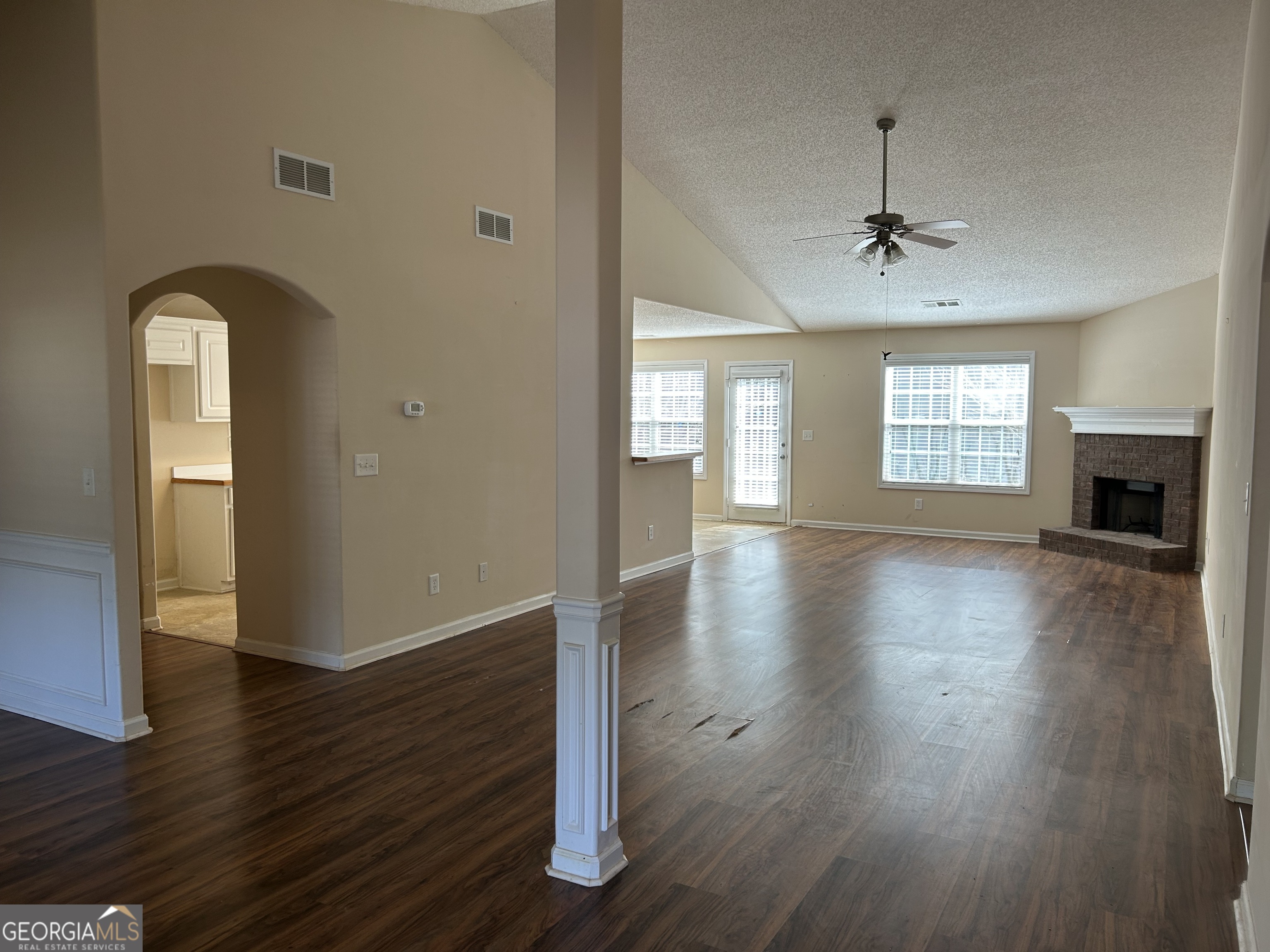 28 Pinewood Circle Colbert, GA 30628 - Photo 10 of 44 a view of an empty room with wooden floor and a window