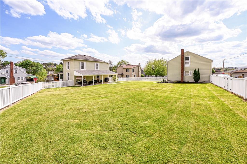 What a plush fenced in area for kids to play, pets to frolic, cornhole tournaments. your dream garden... you decide!