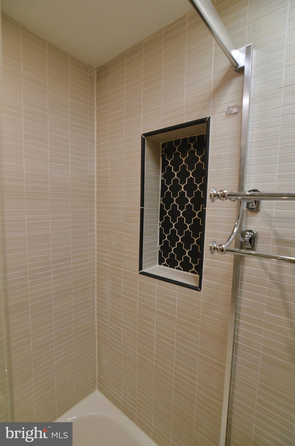 2114 N Street Northwest, Unit 2 Washington, DC 20037 - Photo 20 of 24 a bathroom with a shower and a sink