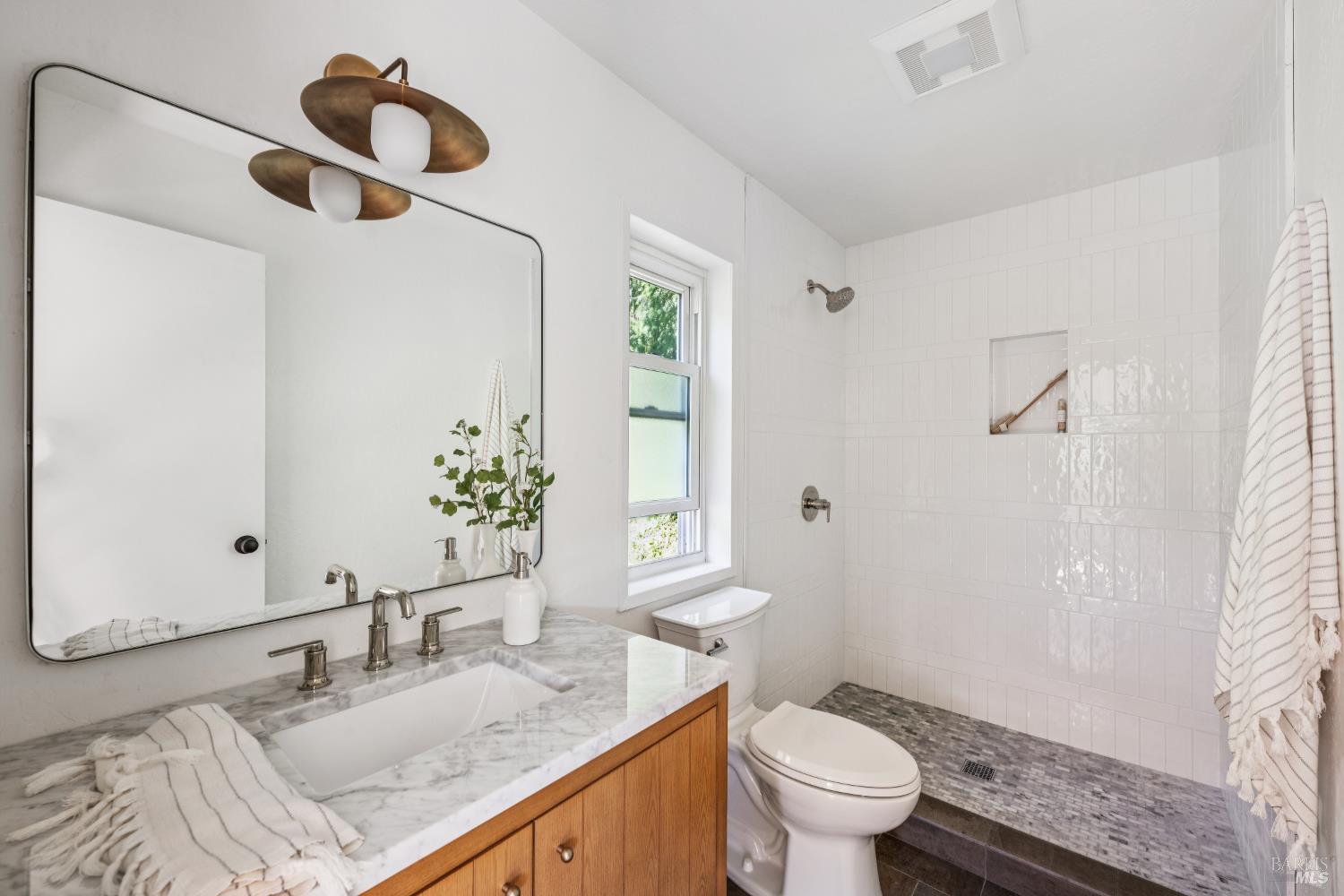 56 Millard Road Larkspur, CA 94939 - Photo 74 of 74 a bathroom with a granite countertop sink mirror vanity and toilet