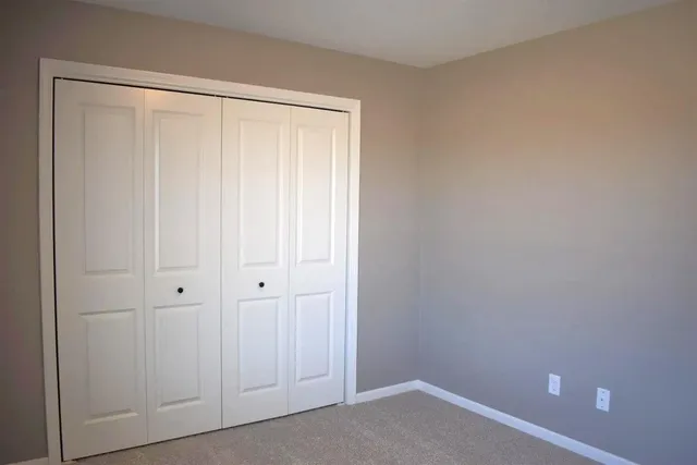 a bathroom with a sink a toilet a mirror and bathtub