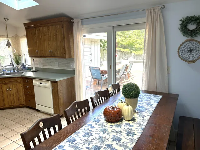 a kitchen with table and window