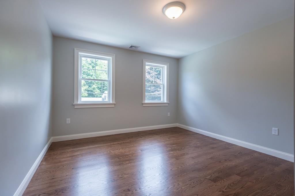 10 College Road Burlington, MA 01803 - Photo 29 of 37 an empty room with wooden floor and windows