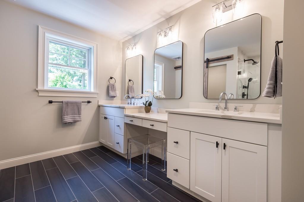 10 College Road Burlington, MA 01803 - Photo 31 of 37 a bathroom with a double vanity sink mirror and a window