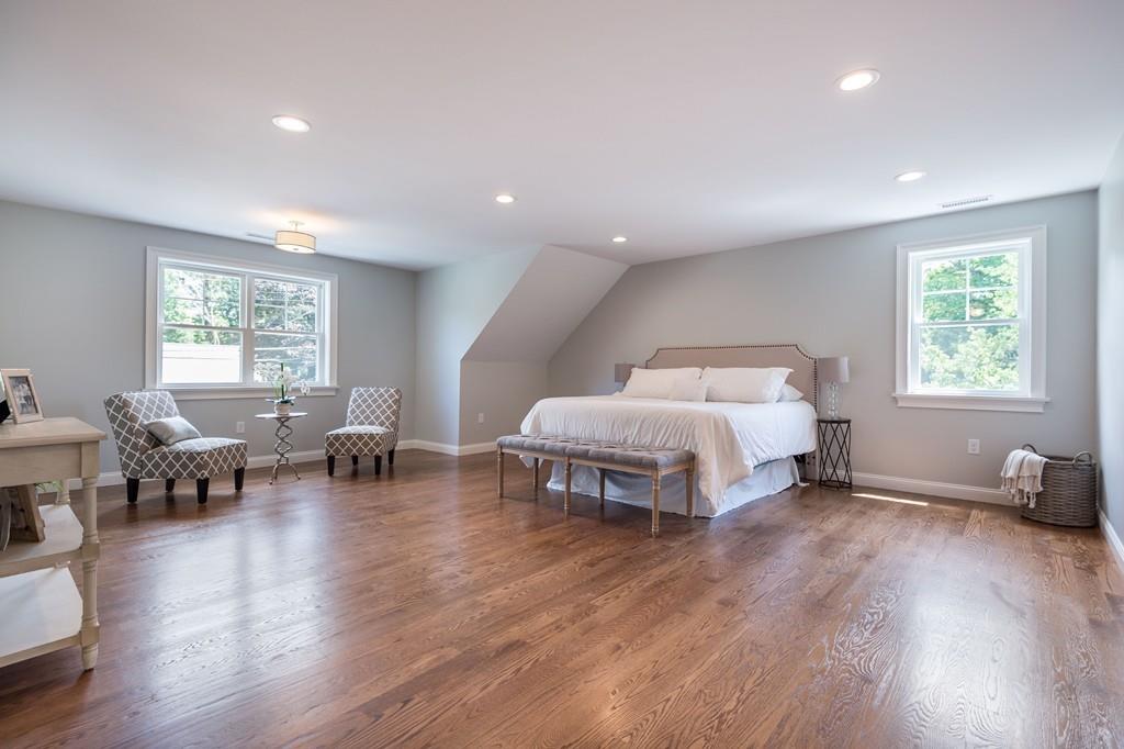 10 College Road Burlington, MA 01803 - Photo 35 of 37 a spacious bedroom with a bed and a couch