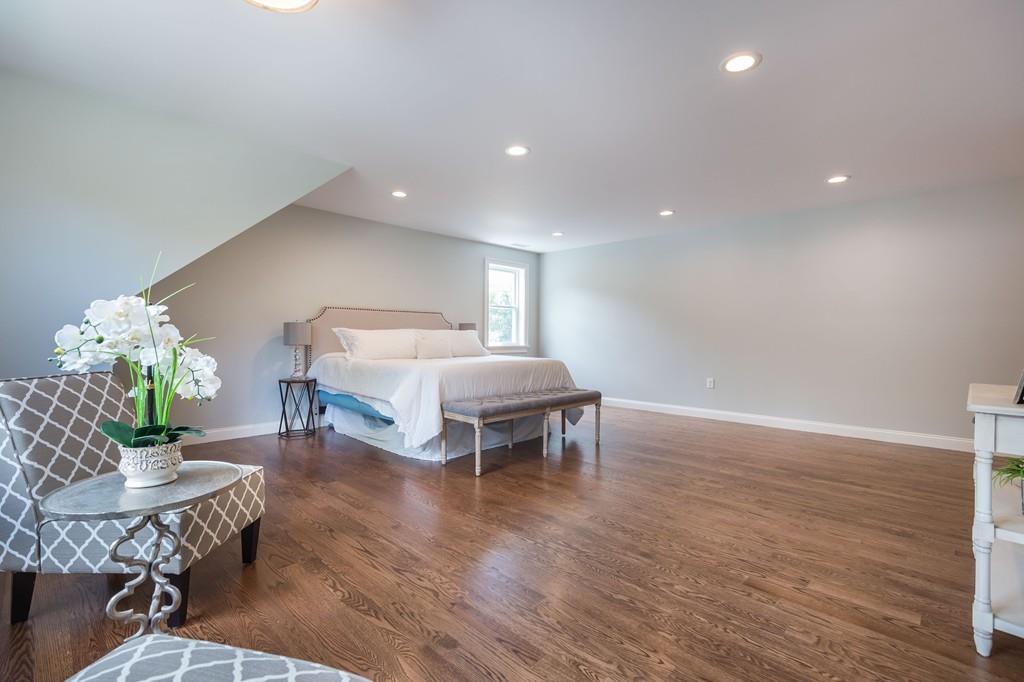 10 College Road Burlington, MA 01803 - Photo 36 of 37 a living room with furniture and a table