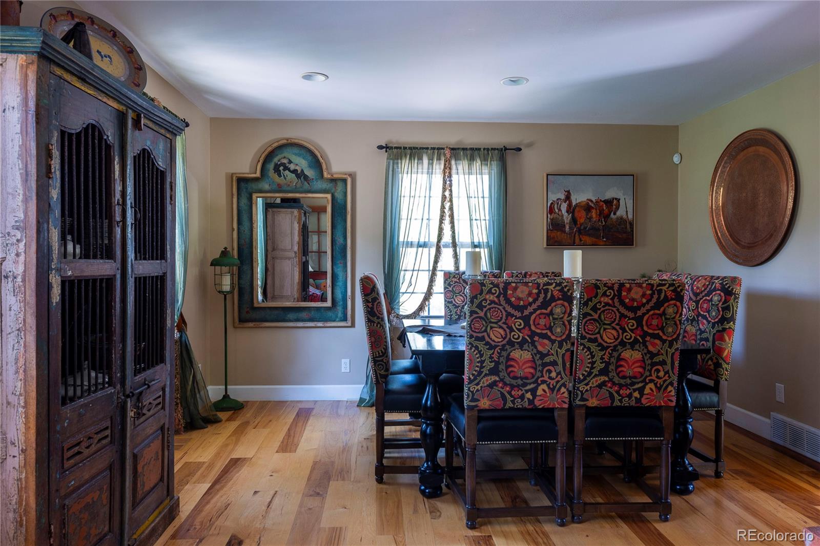 18975 Shadowood Drive Monument, CO 80132 - Photo 16 of 48 a view of a dining room with furniture window and wooden floor