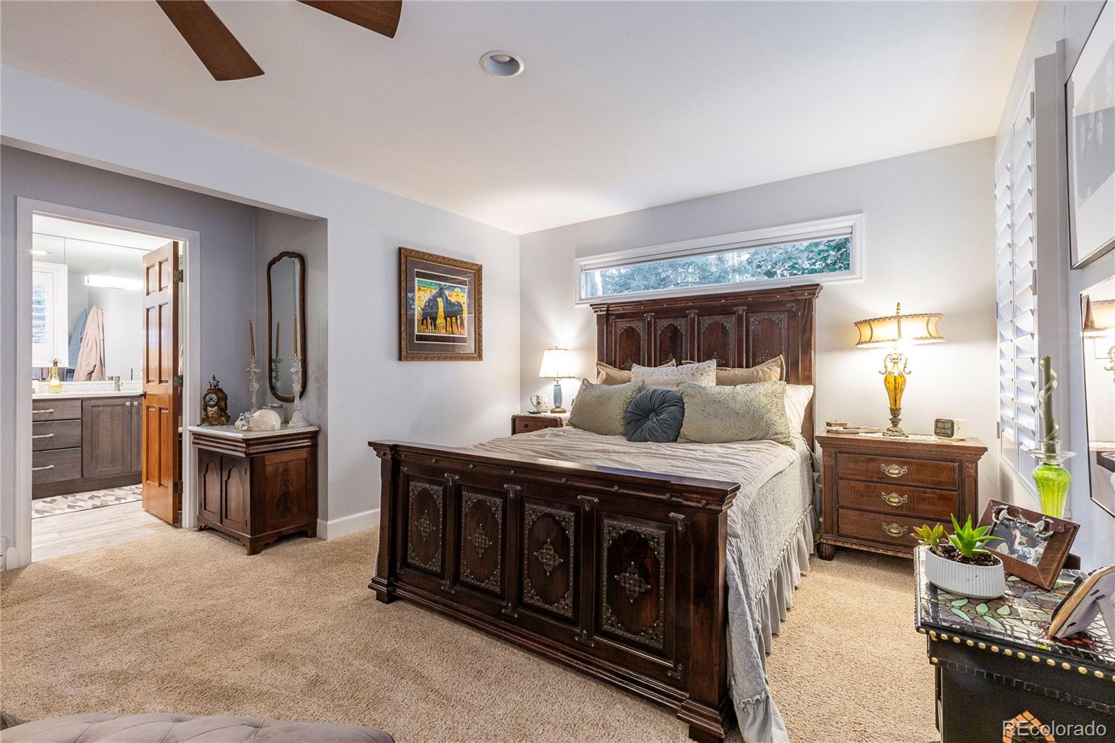 18975 Shadowood Drive Monument, CO 80132 - Photo 20 of 48 a bed room with furniture and a window