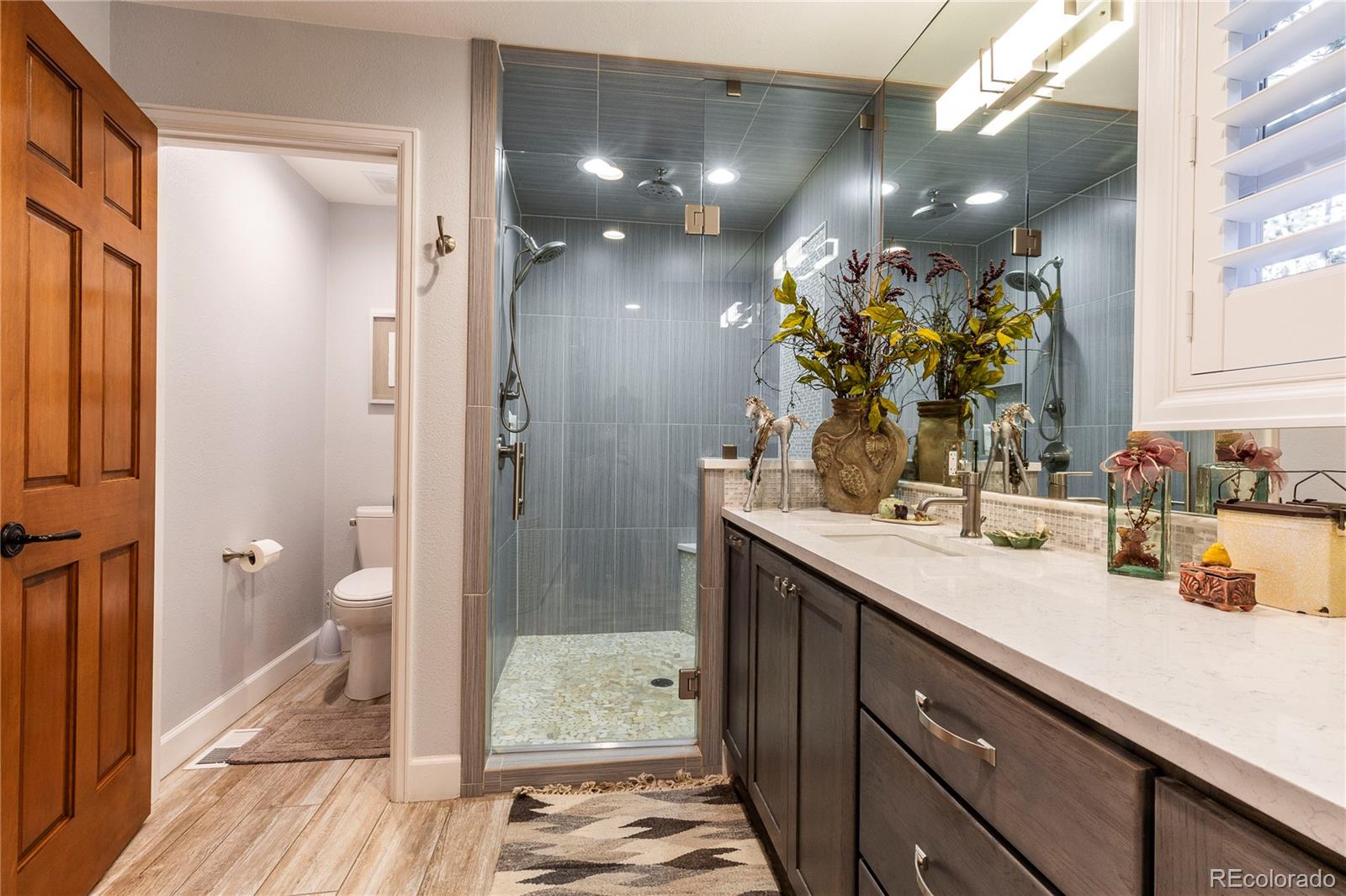 18975 Shadowood Drive Monument, CO 80132 - Photo 22 of 48 a bathroom with a sink and a mirror