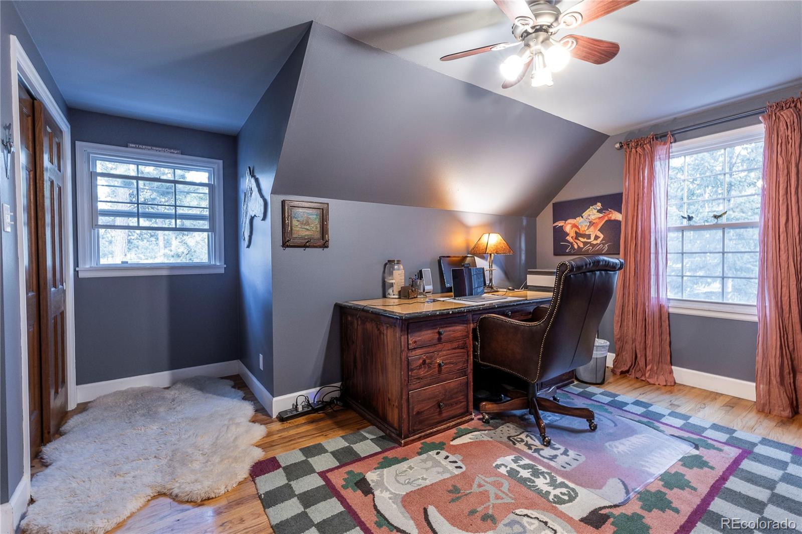 18975 Shadowood Drive Monument, CO 80132 - Photo 27 of 48 a view of a workspace with furniture and a window