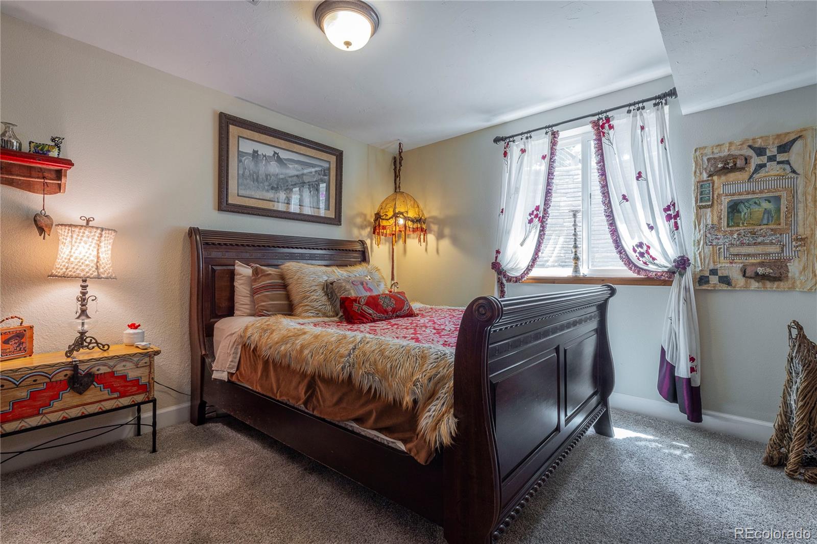 18975 Shadowood Drive Monument, CO 80132 - Photo 33 of 48 a bedroom with a bed and a window