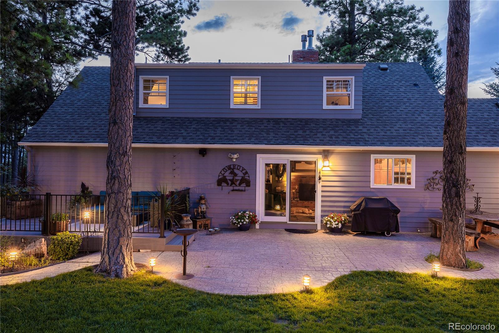 18975 Shadowood Drive Monument, CO 80132 - Photo 36 of 48 a view of a house with backyard and porch