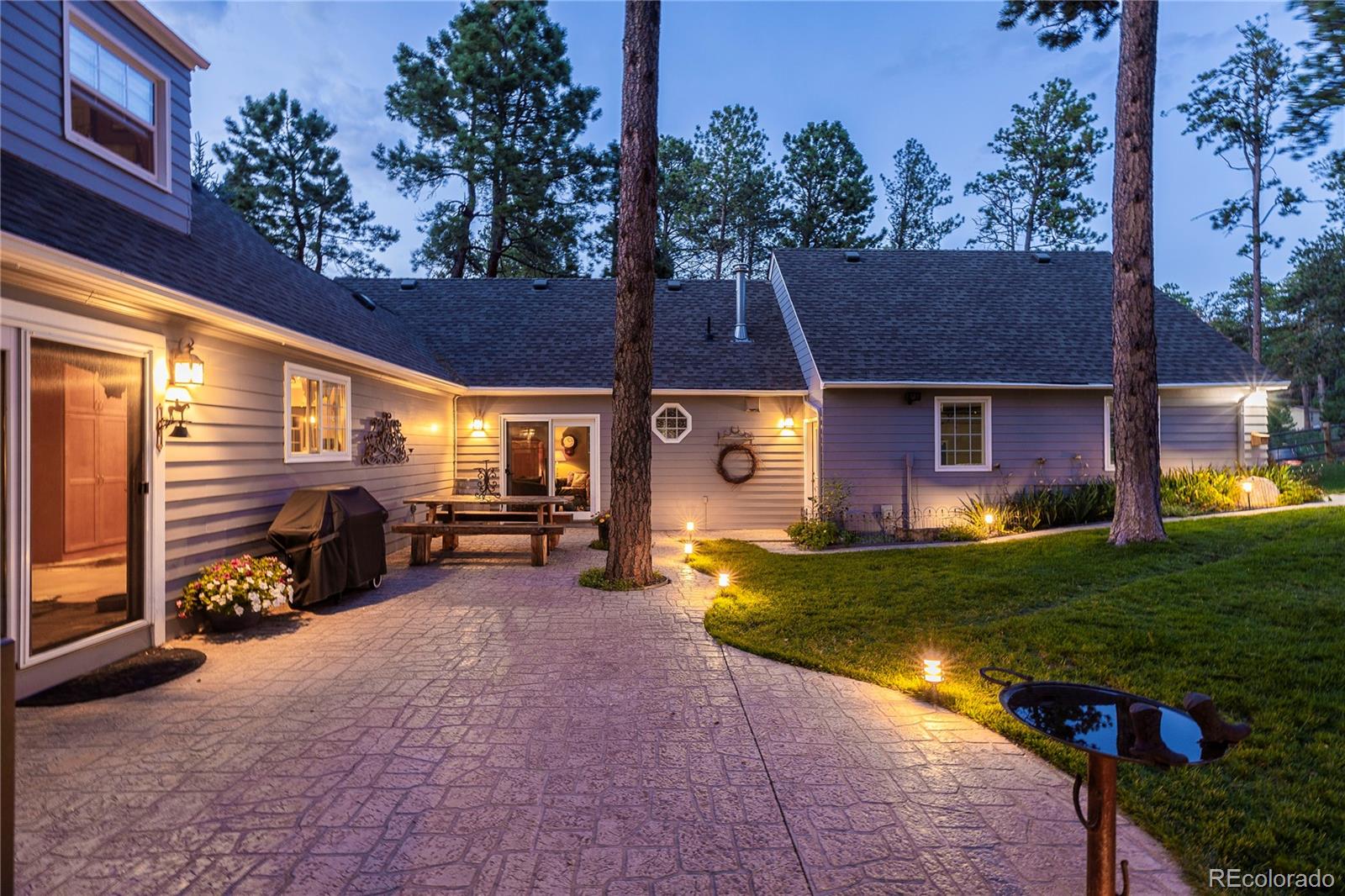 18975 Shadowood Drive Monument, CO 80132 - Photo 37 of 48 a view of a house with backyard barbeque and sitting area