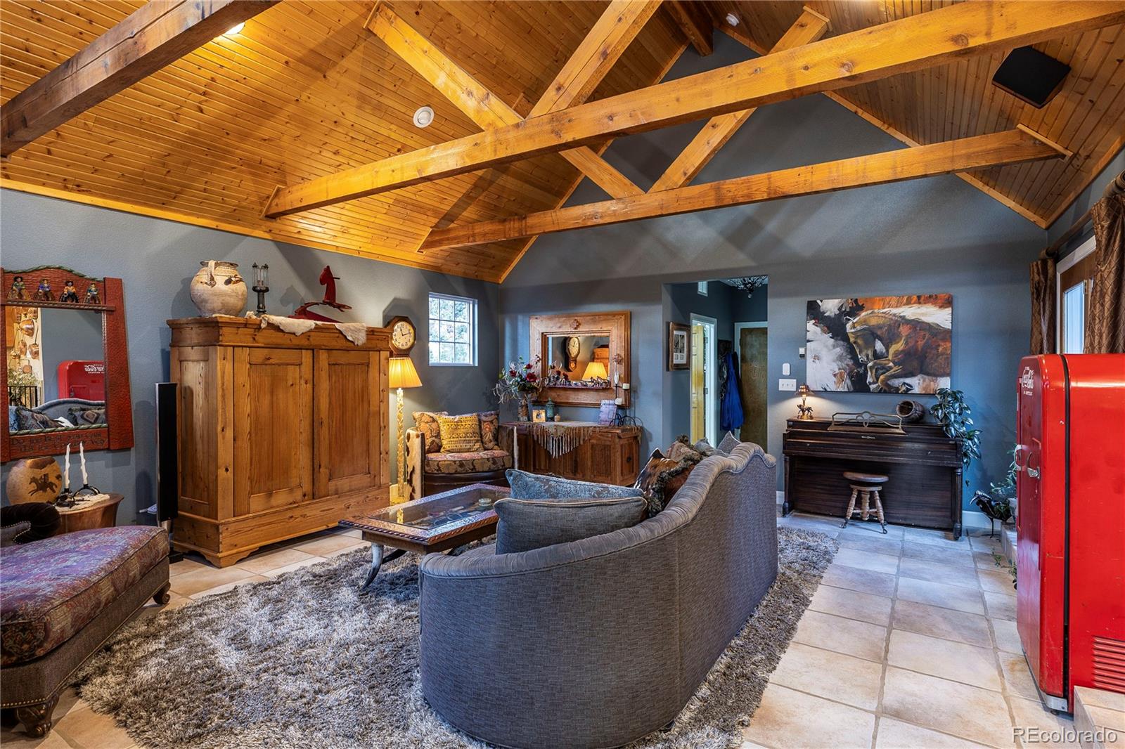 18975 Shadowood Drive Monument, CO 80132 - Photo 4 of 48 a living room with furniture a couch and dresser