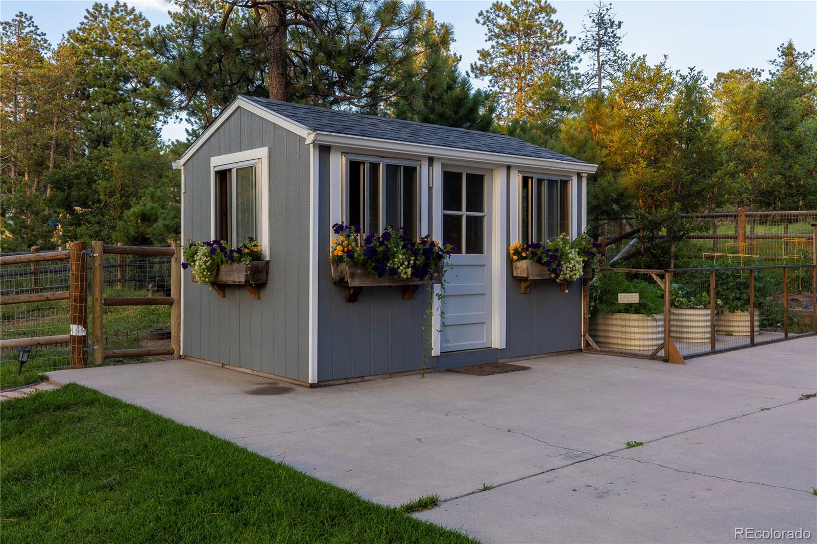 18975 Shadowood Drive Monument, CO 80132 - Photo 42 of 48 a view of a house with porch and garden
