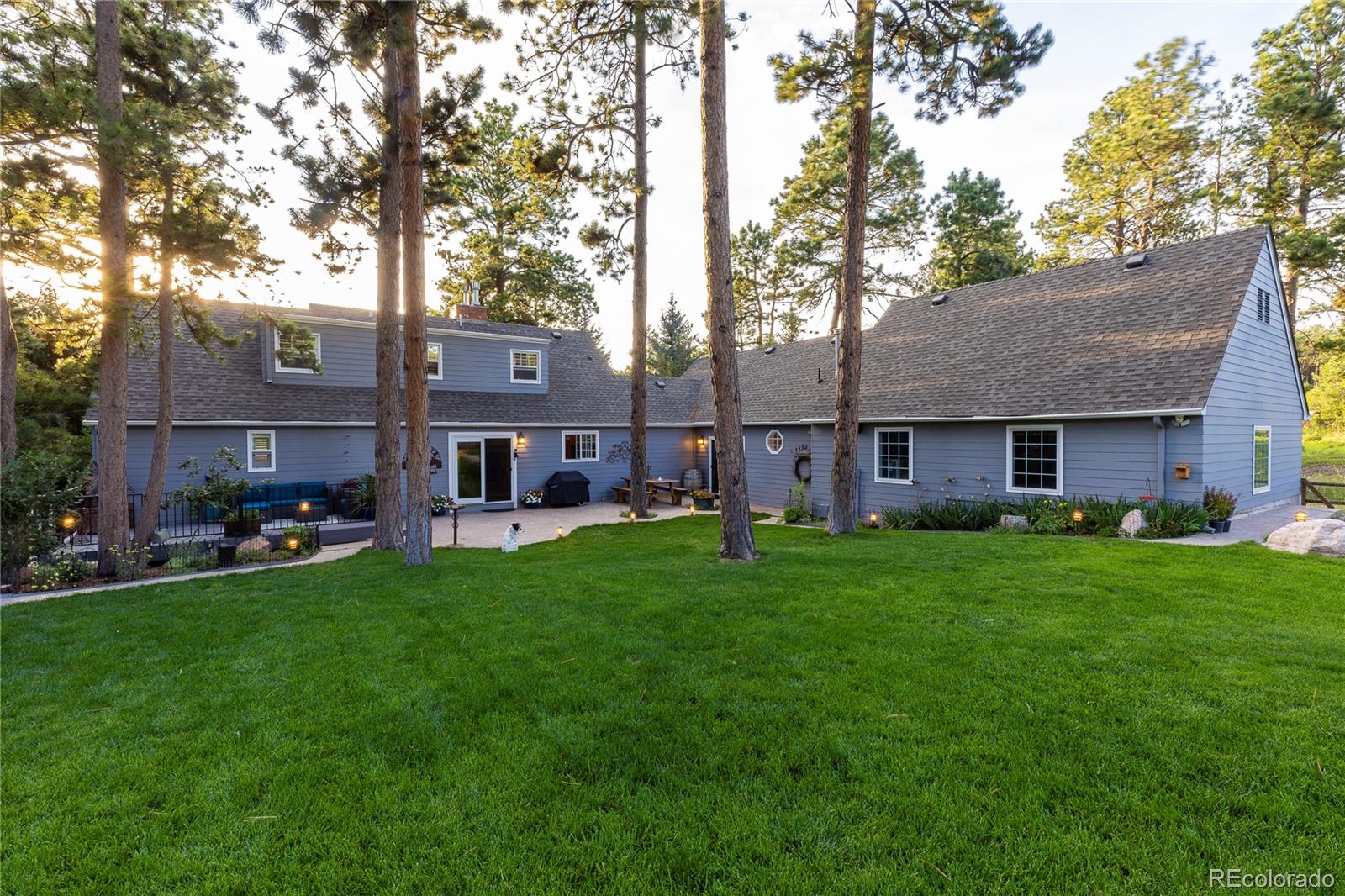 18975 Shadowood Drive Monument, CO 80132 - Photo 45 of 48 a view of a house with a yard and sitting area