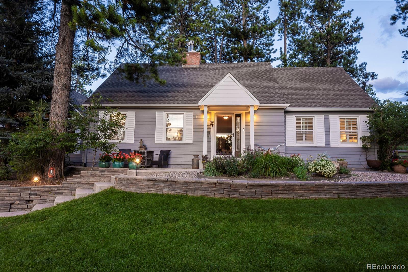 18975 Shadowood Drive Monument, CO 80132 - Photo 48 of 48 a front view of a house with a garden and plants