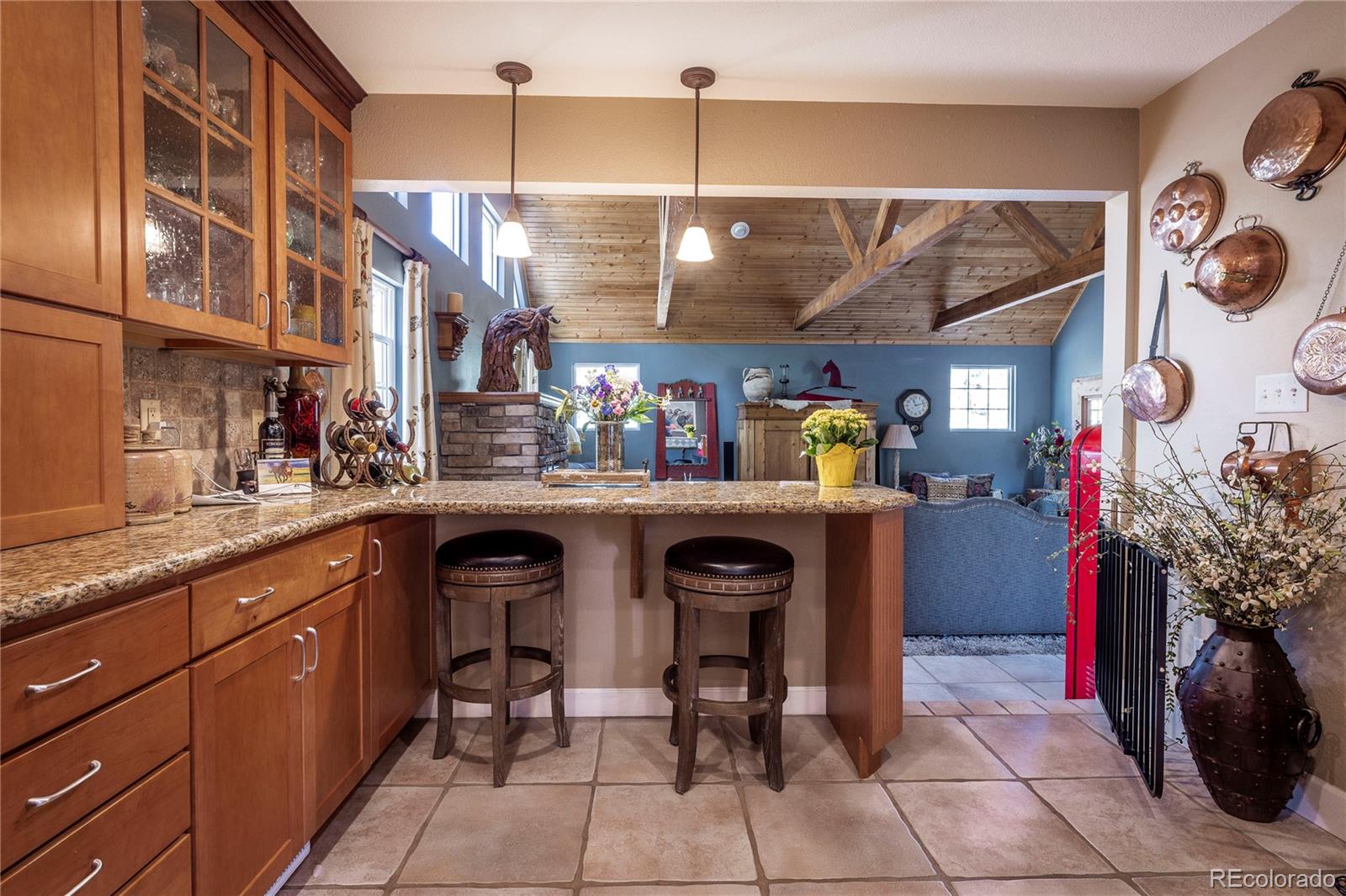 18975 Shadowood Drive Monument, CO 80132 - Photo 9 of 48 a kitchen with a sink and cabinets