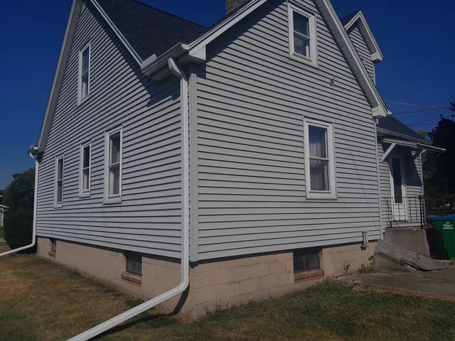 a view of a house with a small yard