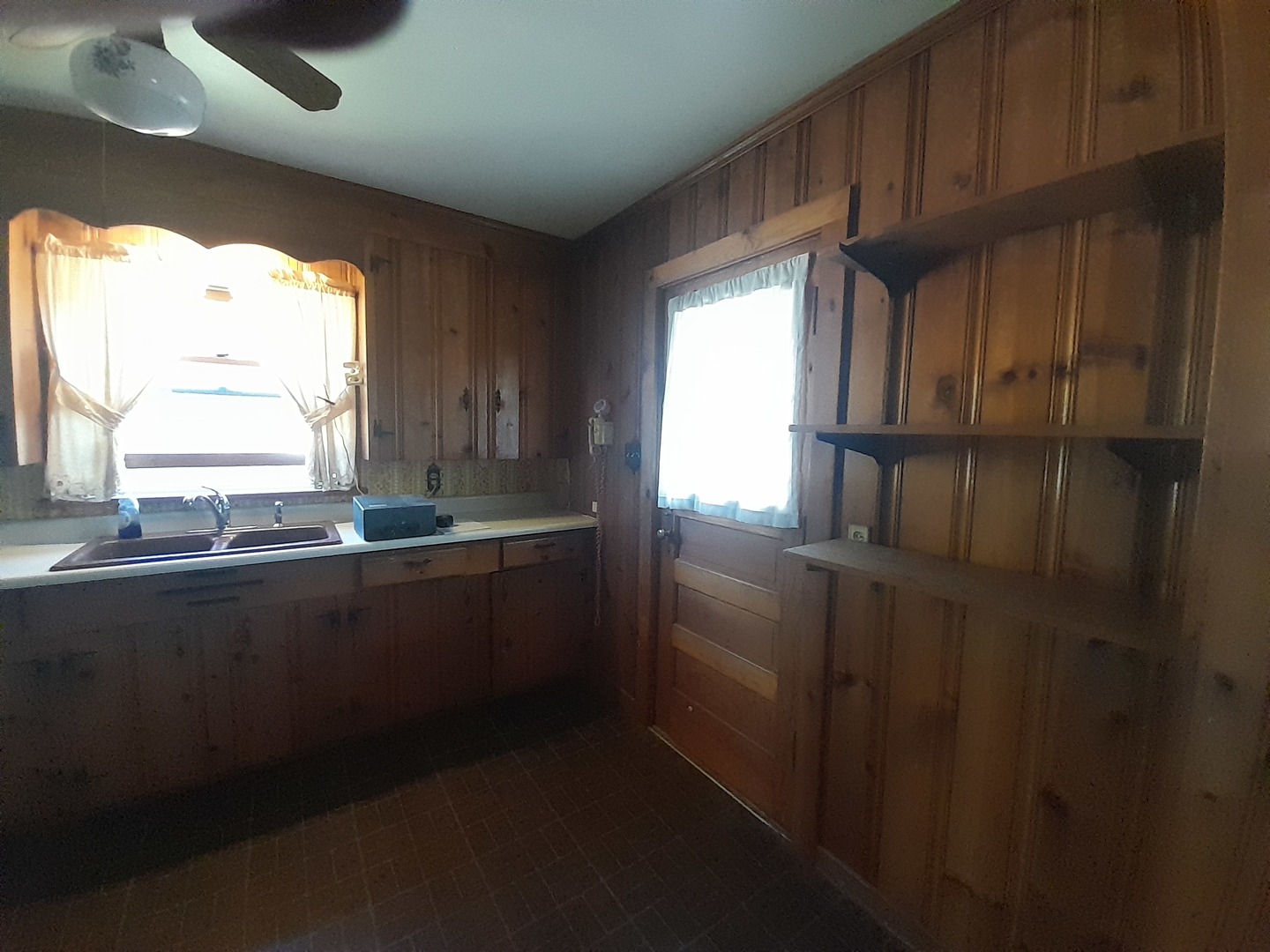 211 4th Avenue Mendota, IL 61342 - Photo 8 of 25 a kitchen with granite countertop wooden cabinets and a window