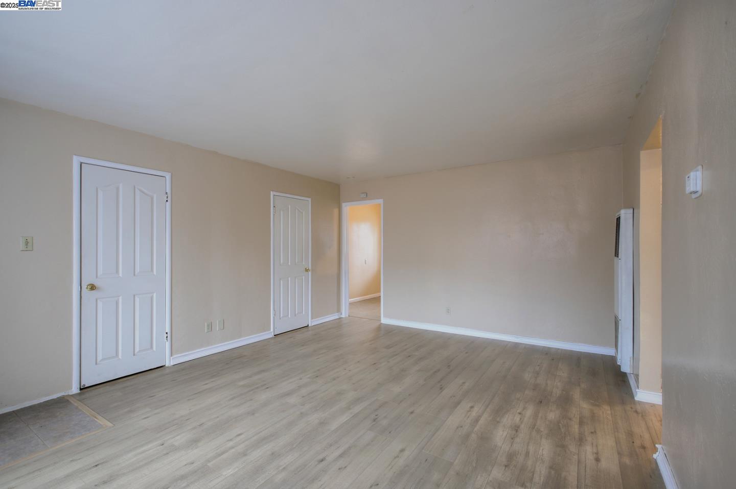 7448 Lockwood Street Oakland, CA 94621 - Photo 15 of 35 a view of an empty room and wooden floor