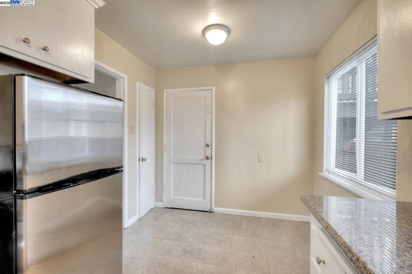 7448 Lockwood Street Oakland, CA 94621 - Photo 20 of 35 a view of an empty room with a window