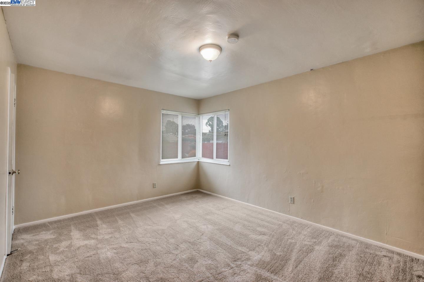 7448 Lockwood Street Oakland, CA 94621 - Photo 21 of 35 a view of an empty room with a window