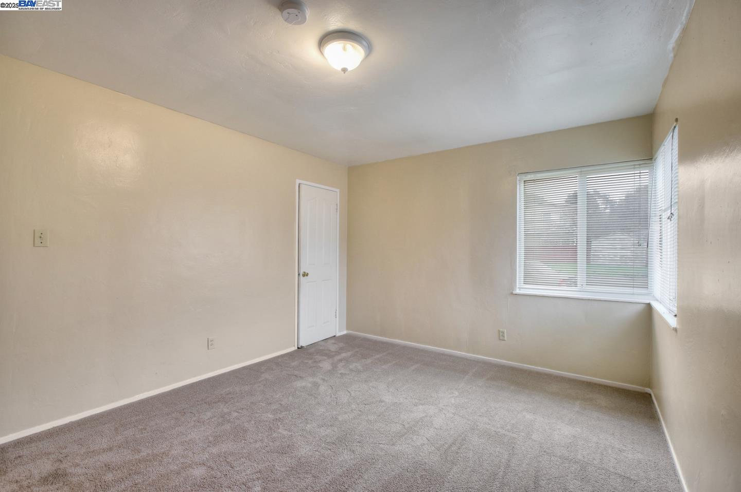 7448 Lockwood Street Oakland, CA 94621 - Photo 22 of 35 an empty room with a window