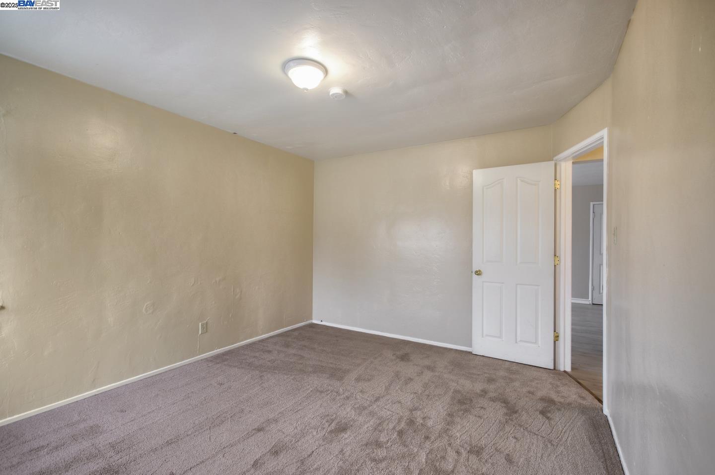 7448 Lockwood Street Oakland, CA 94621 - Photo 24 of 35 a view of an empty room and wooden floor