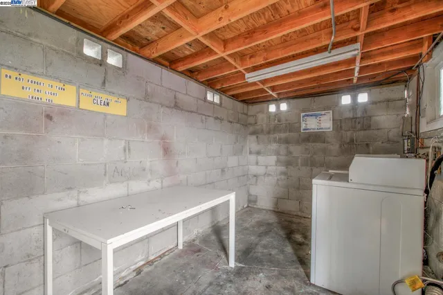 a utility room with a wooden floor