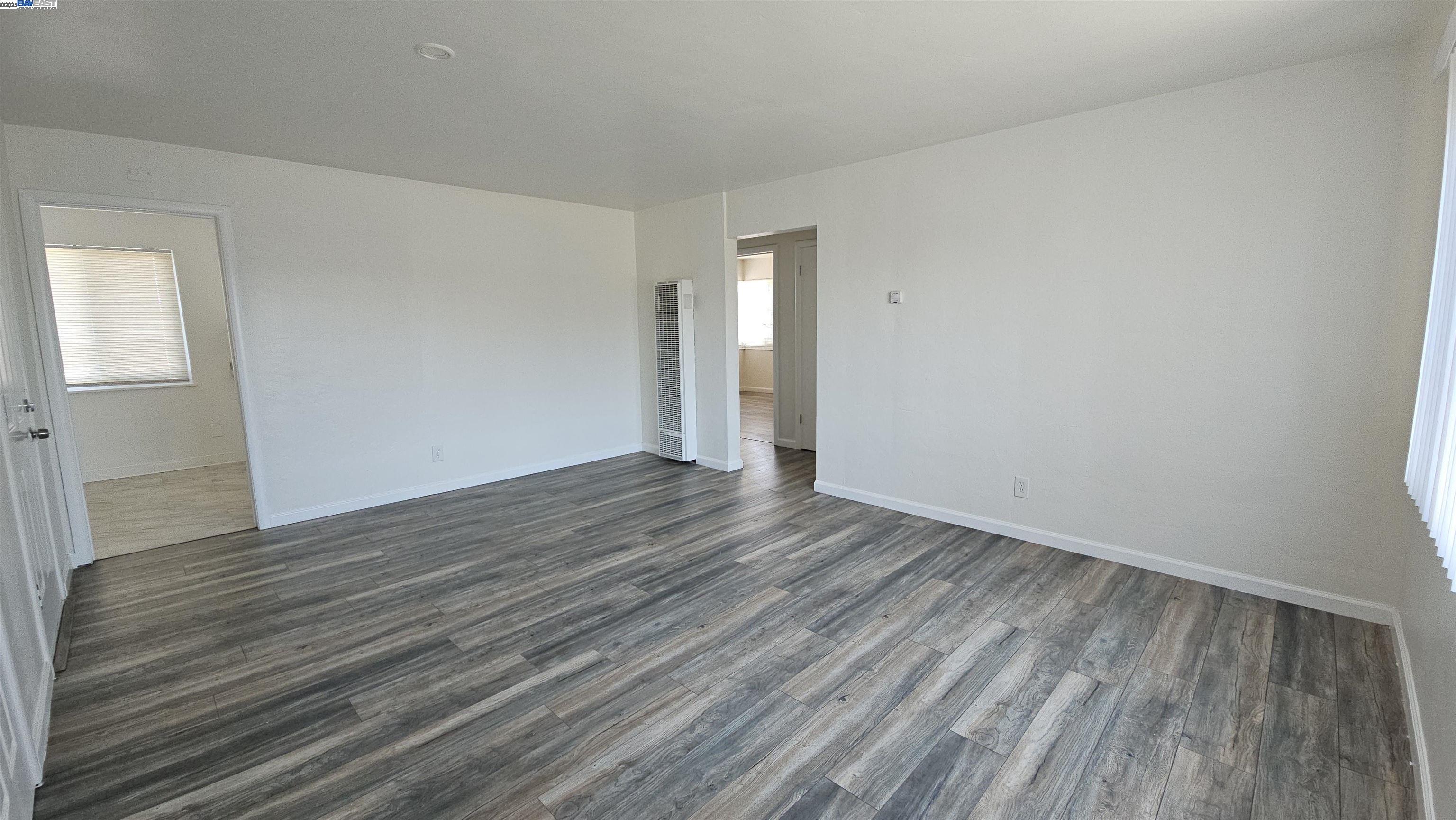 7448 Lockwood Street Oakland, CA 94621 - Photo 8 of 35 wooden floor in a empty room