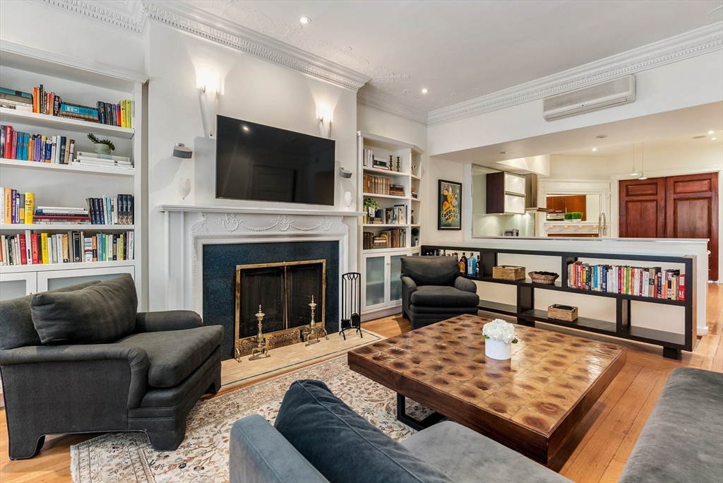 37 Bay State Road, Unit 3 Boston, MA 02215 - Photo 3 of 18 a living room with furniture fireplace and flat screen tv