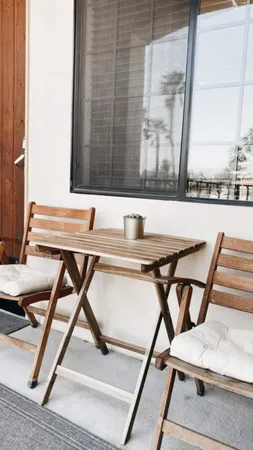 a workspace with a table chair and a window