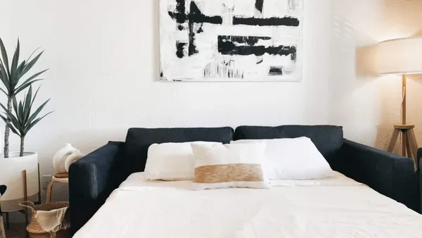 a large white bed in a white room