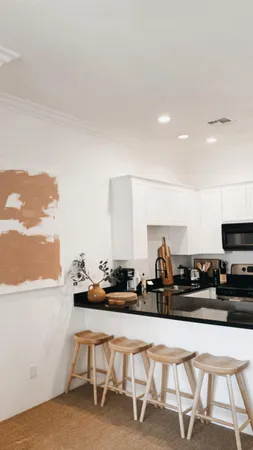 a kitchen with a table and chairs in it