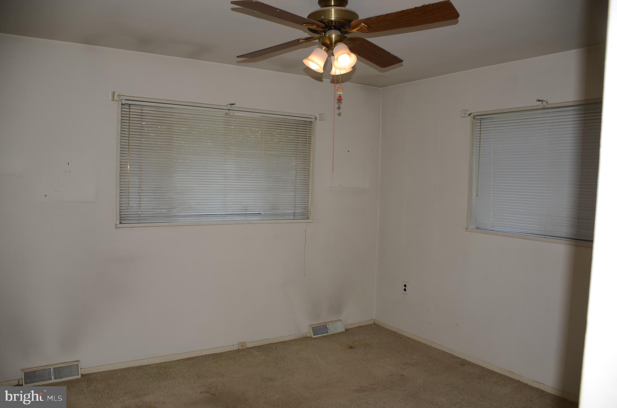 11 Homewood Road Wilmington, DE 19803 - Photo 3 of 47 an empty room with a window and a fan