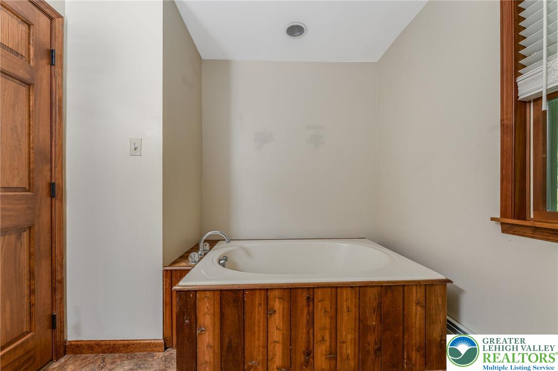 465 Raubsville Road Easton, PA 18042 - Photo 31 of 60 First floor primary bath. Relax and unwind in this spacious built-in soaking tub.