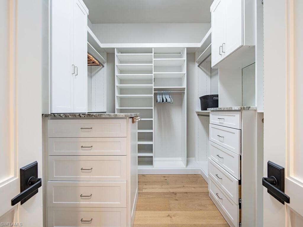 9200 Mercato Way Naples, FL 34108 - Photo 13 of 13 a view of walk in closet with clothes